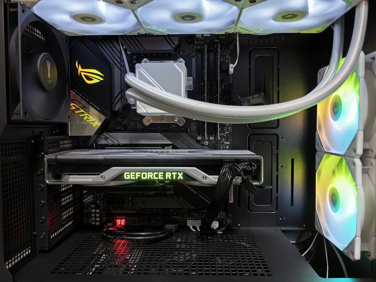 home-hero Detailed view of a gaming PC build featuring a GeForce RTX graphics card and RGB lighting in a sleek black case.
